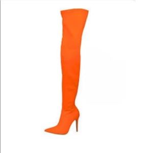Orange suede thigh high boots